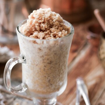 A glass cup filled with coffee and cream granita.