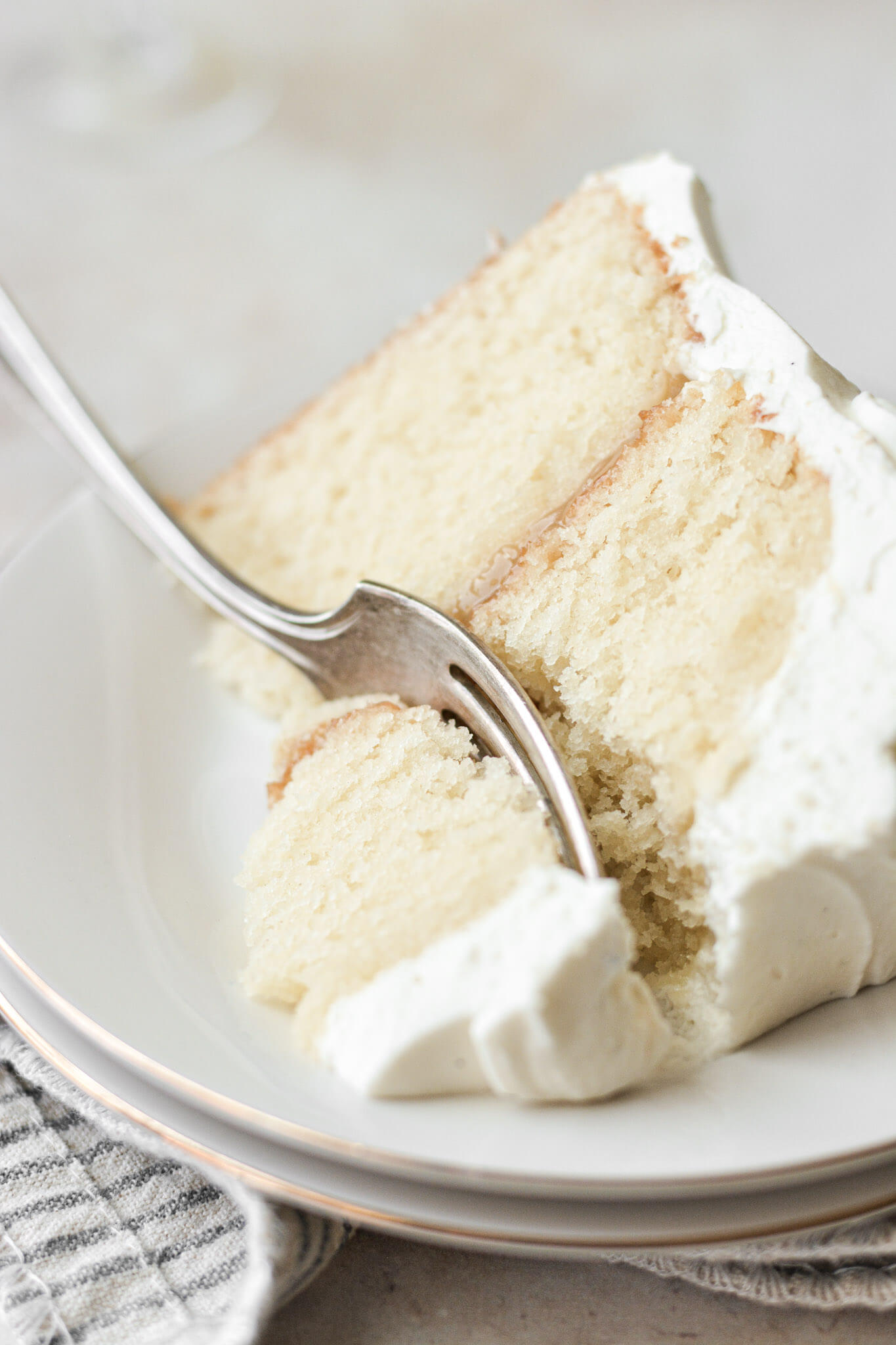 Slice of limoncello cake with a fork.