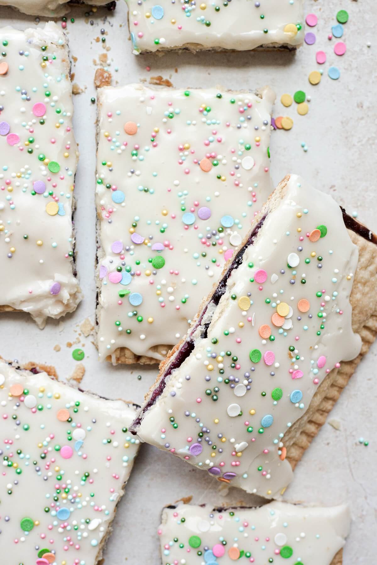 Blueberry pop tarts with icing and sprinkles.