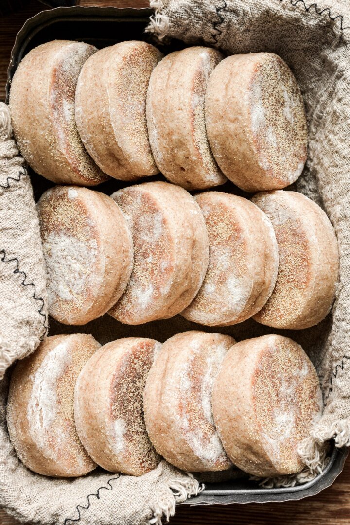 English muffins arranged in a metal tin.