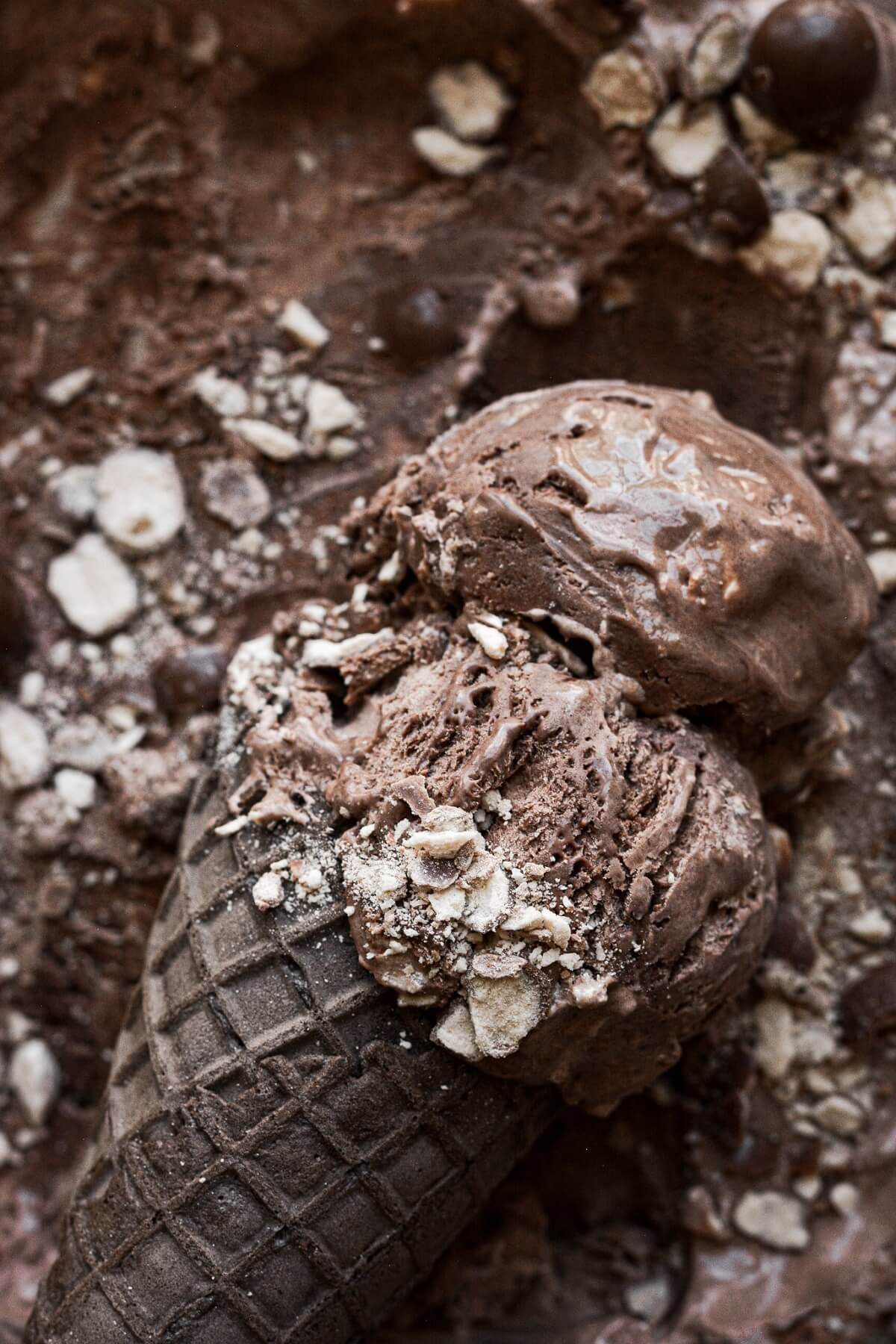 A chocolate ice cream cone with chocolate malt ice cream.