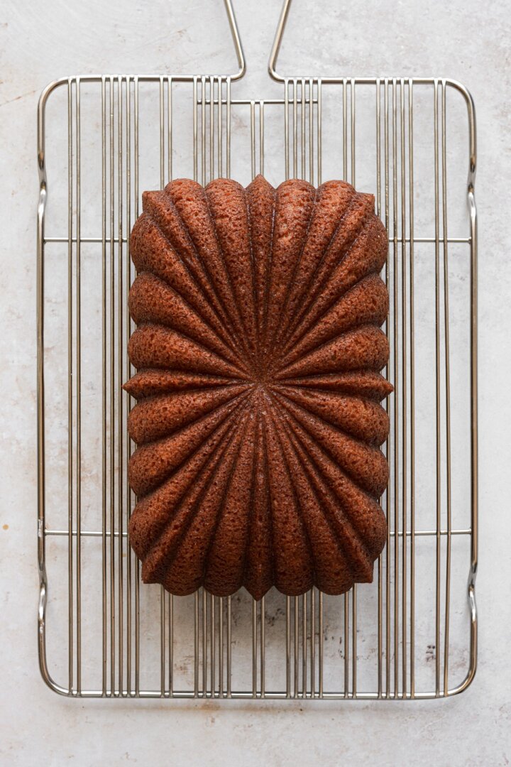 Loaf cake on a cooling rack.