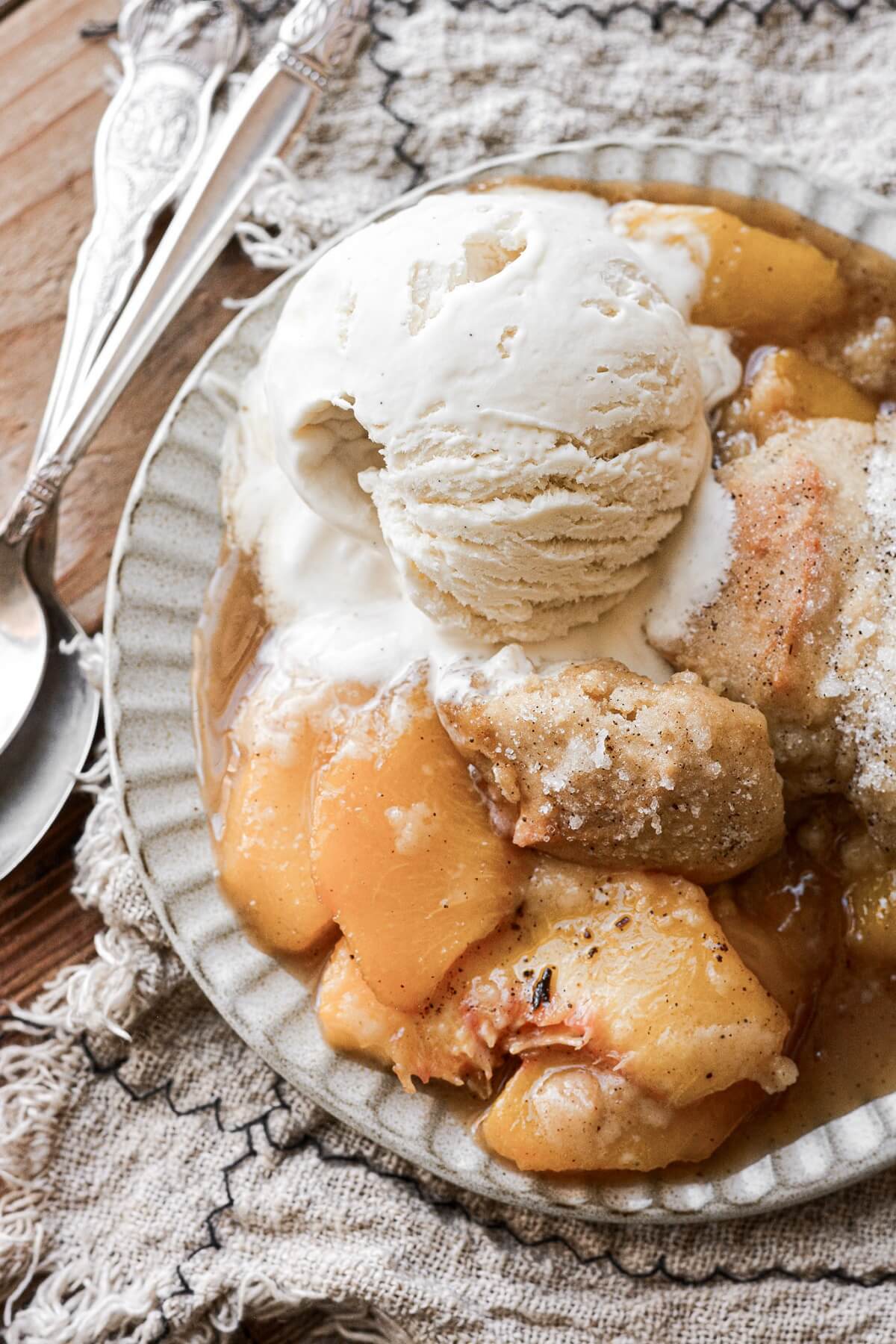 Peach cobbler with vanilla ice cream.