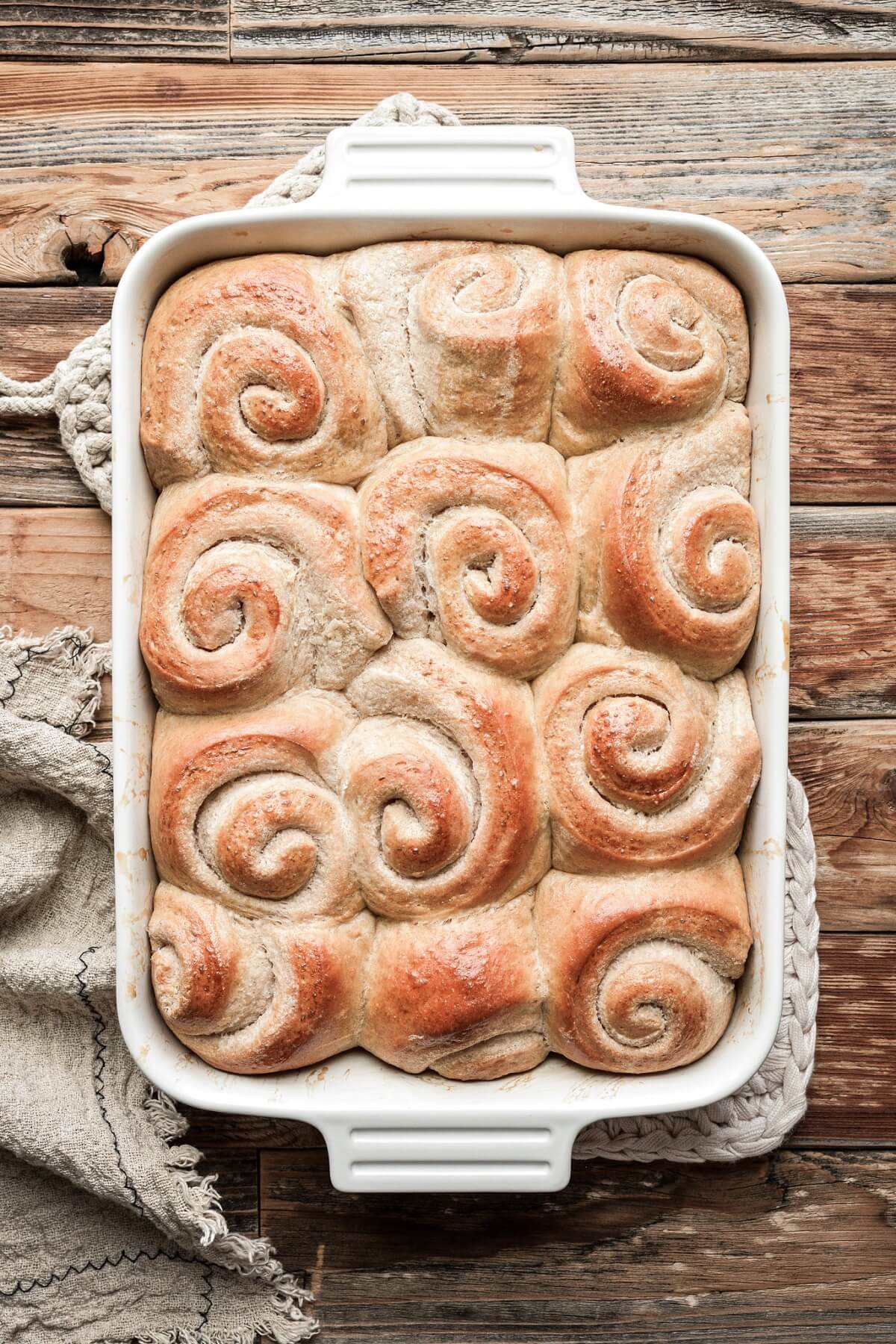 Just baked cinnamon honey dinner rolls shaped in spirals.