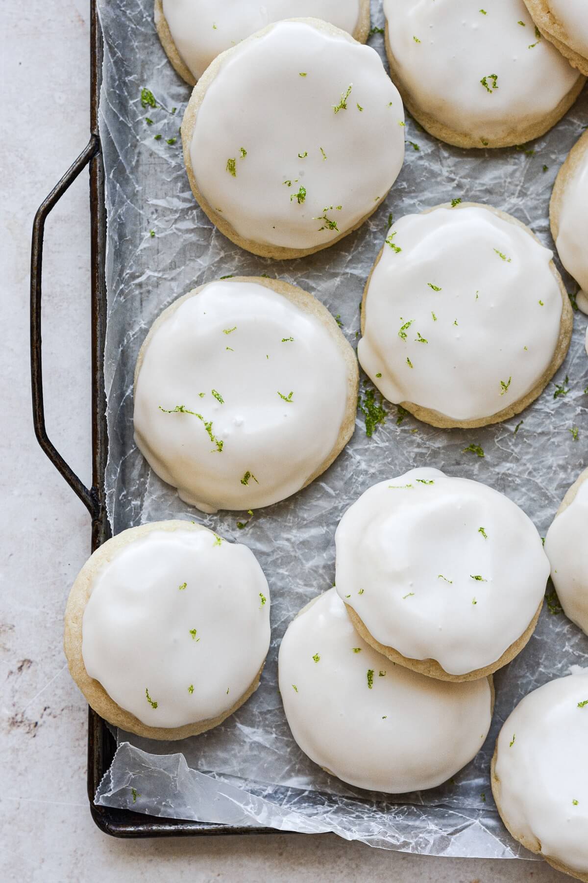 Lime sugar cookies with icing and fresh lime zest.