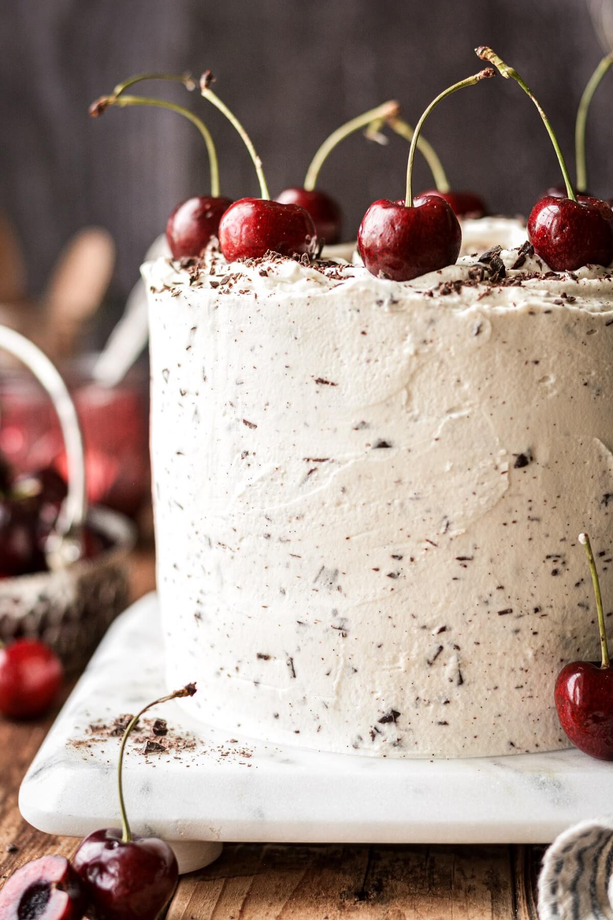 Fresh cherries on a white forest cake.