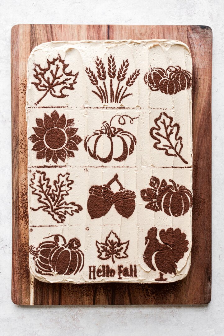 Coffee buttercream with fall themed cocoa powder stencils.