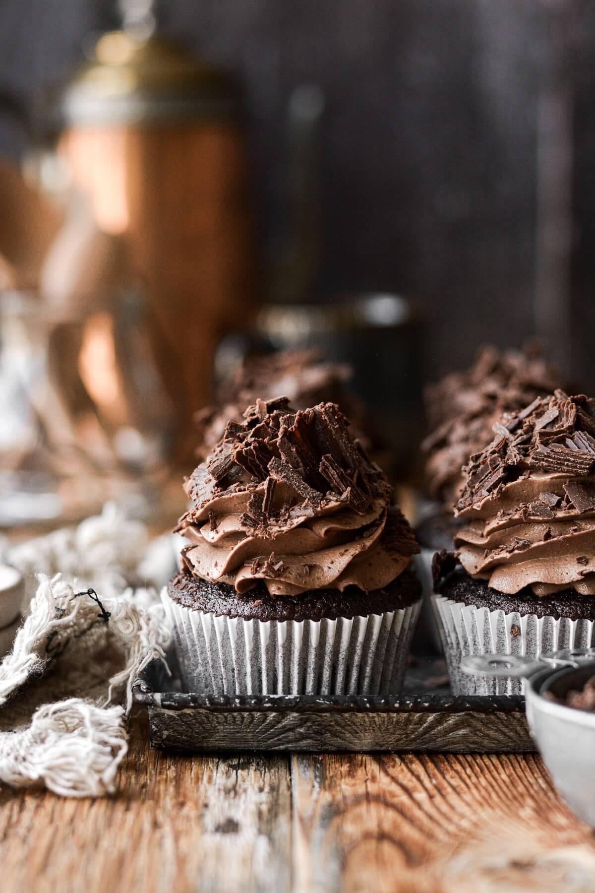 Chocolate cupcakes with espresso buttercream and chocolate shavings.