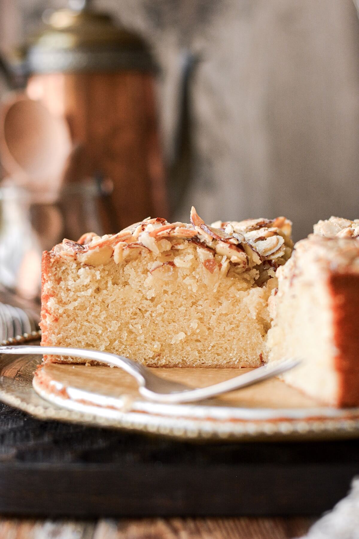 Italian almond cake with a slice cut.