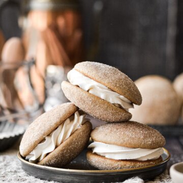 Snickerdoodle whoopie pies on a plate.