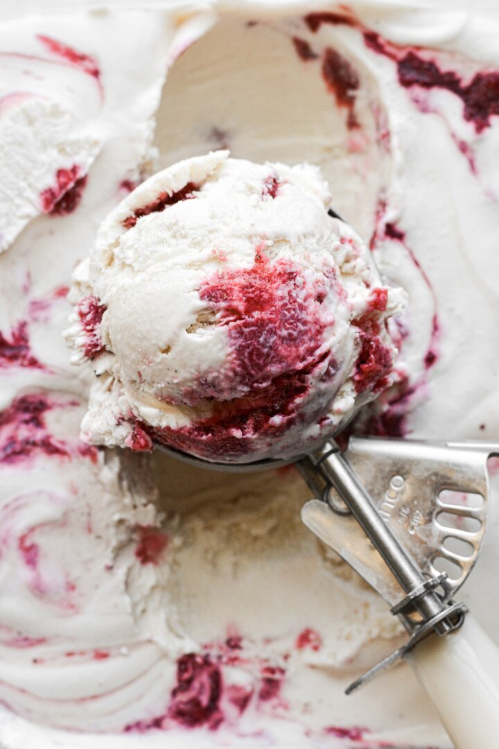 Scoop of strawberry swirl vanilla malted milk ice cream.