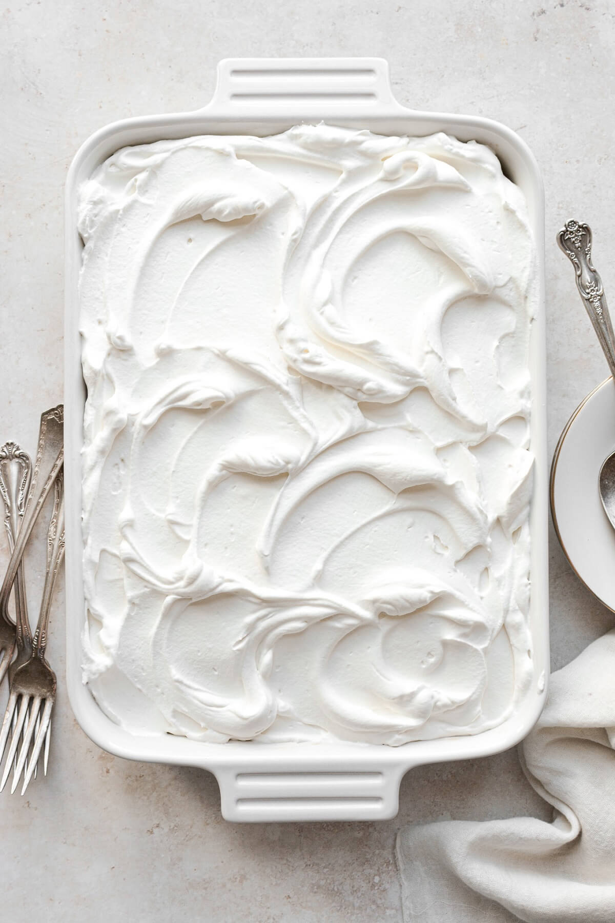 Tres leches cake with whipped cream frosting.