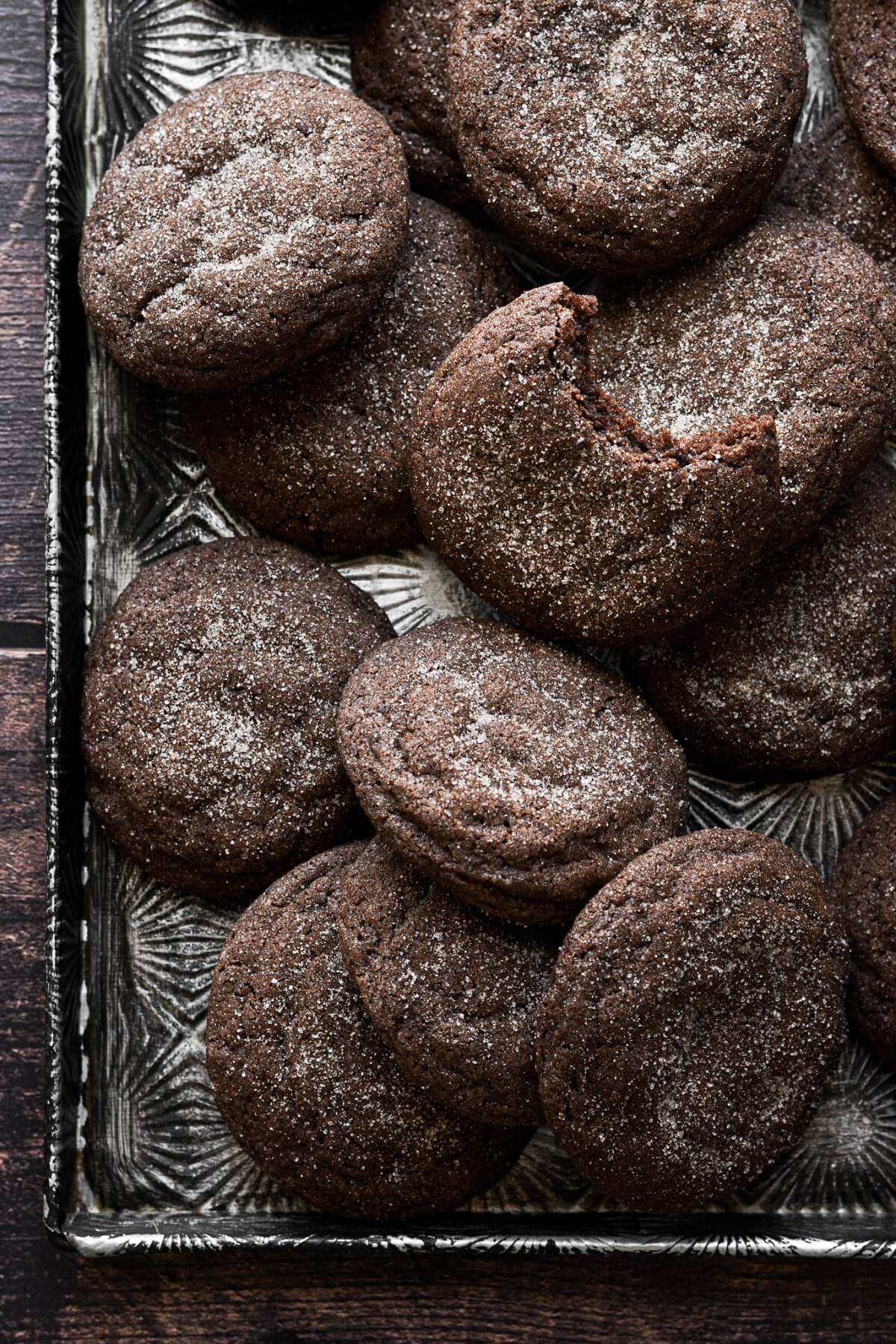 Chocolate snickerdoodles on a baking sheet.