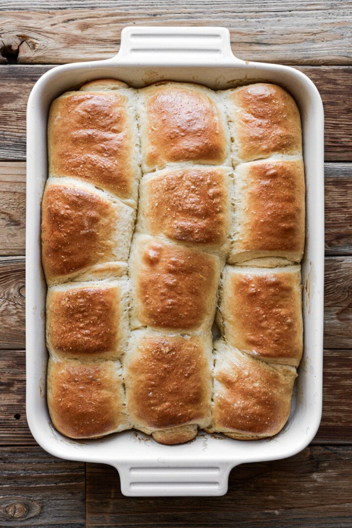 Parker House dinner rolls in a baking dish.