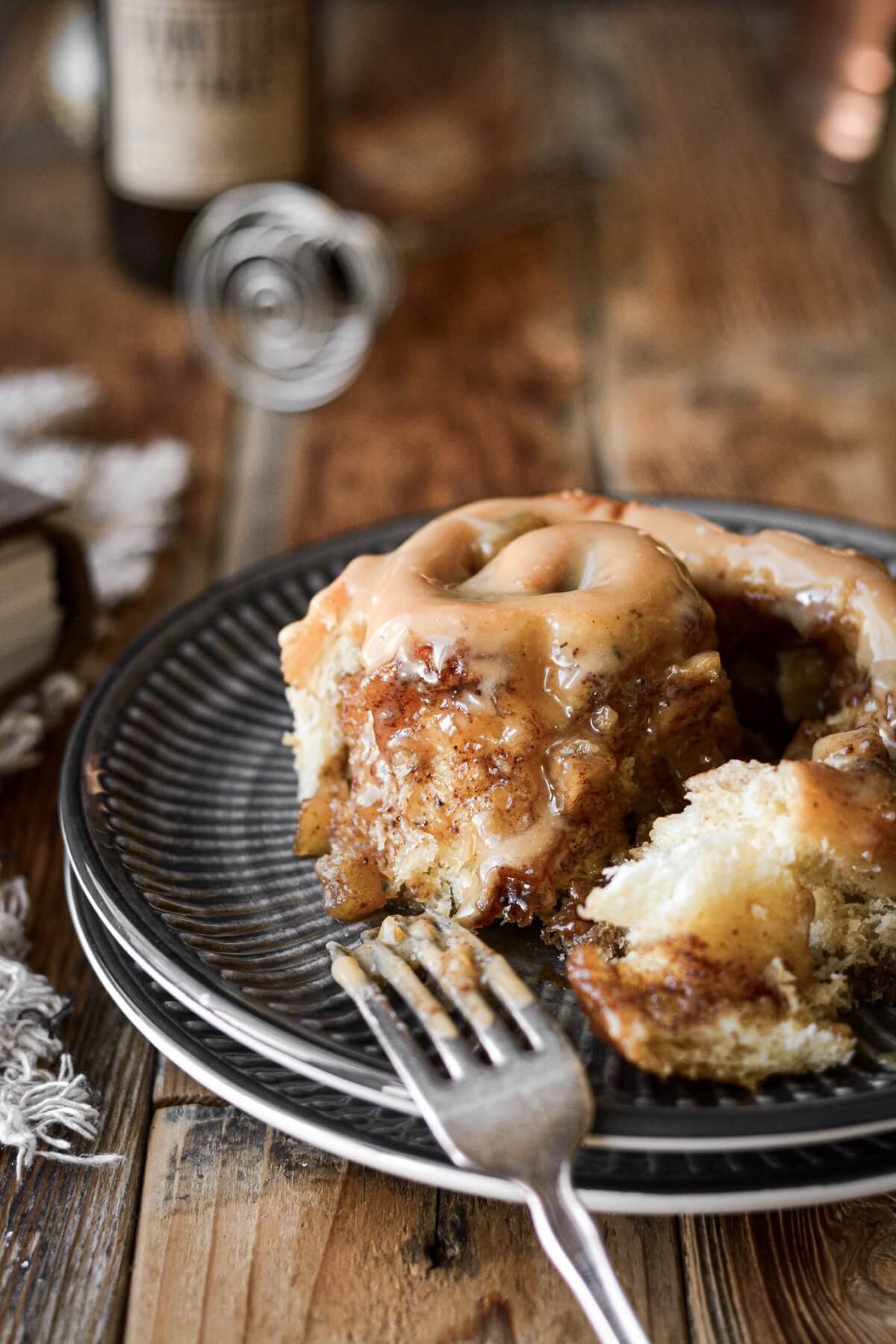 Apple pie cinnamon roll unrolled to show the filling inside.