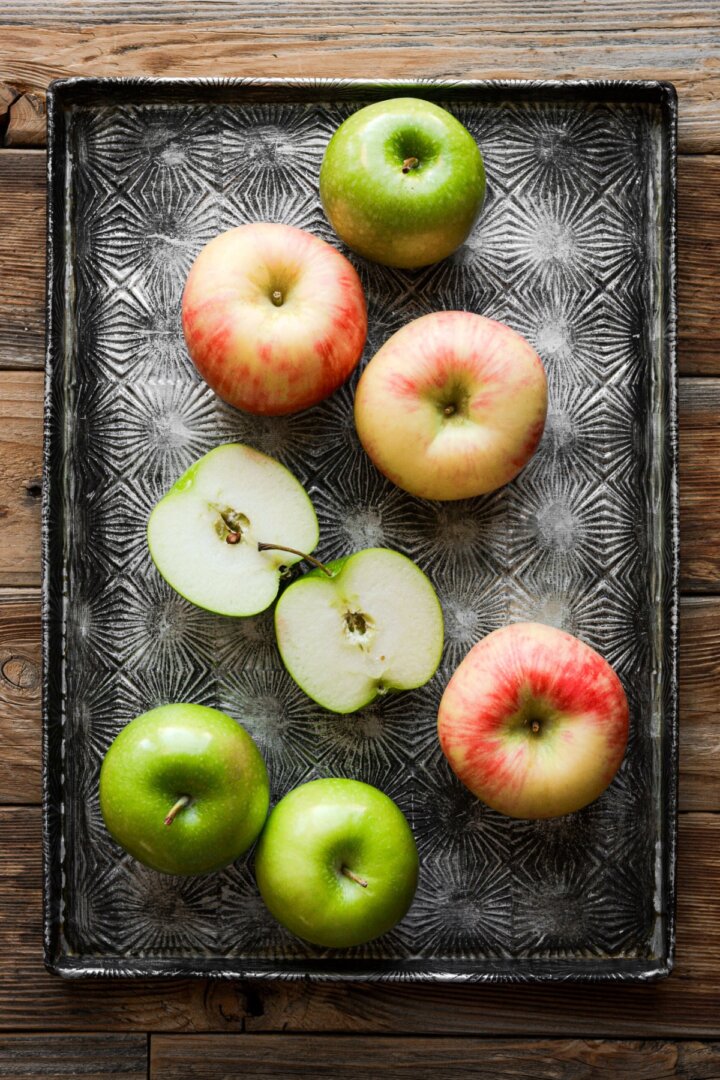 Apples on a baking sheet.