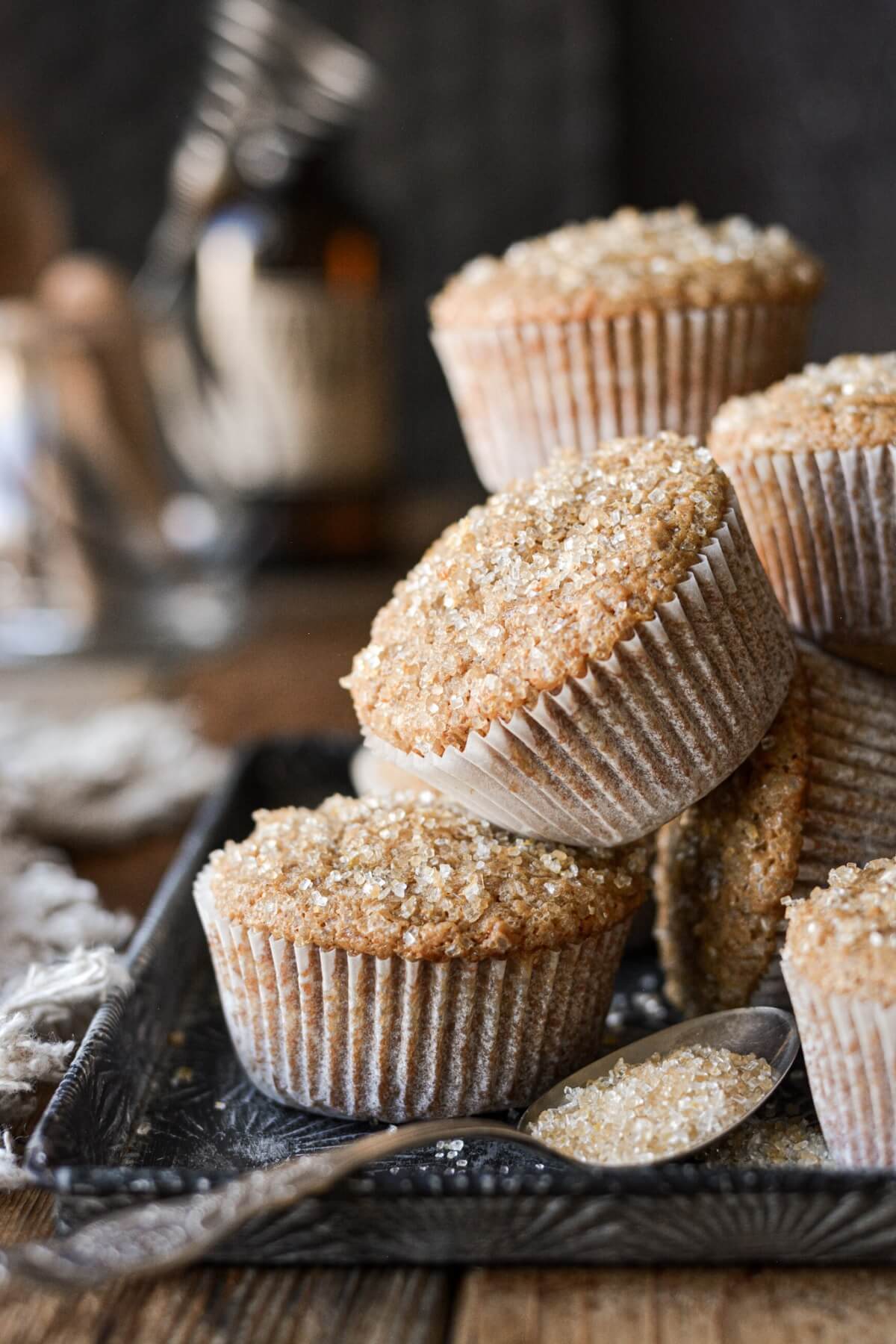 Gingerbread muffins stacked on a baking sheet.