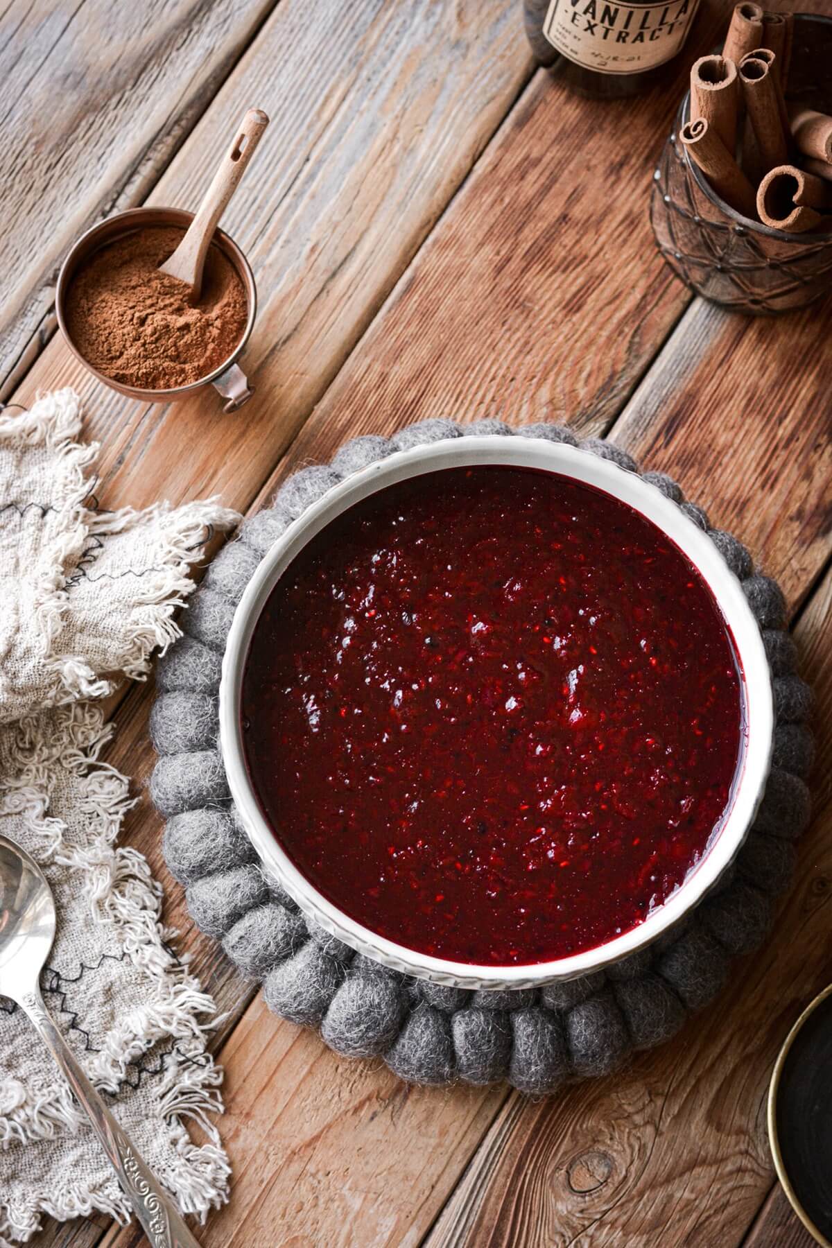 Danish red berry pudding on a woolen trivet.