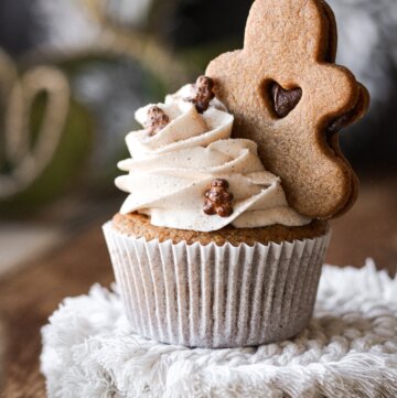 Gingerbread cookie on top of a gingerbread cupcake.