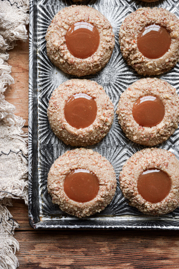 Gingerbread pecan thumbprint cookies filled with caramel.