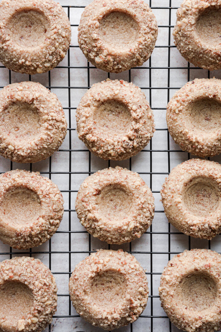 Just baked gingerbread thumbprint cookies coated in pecans.