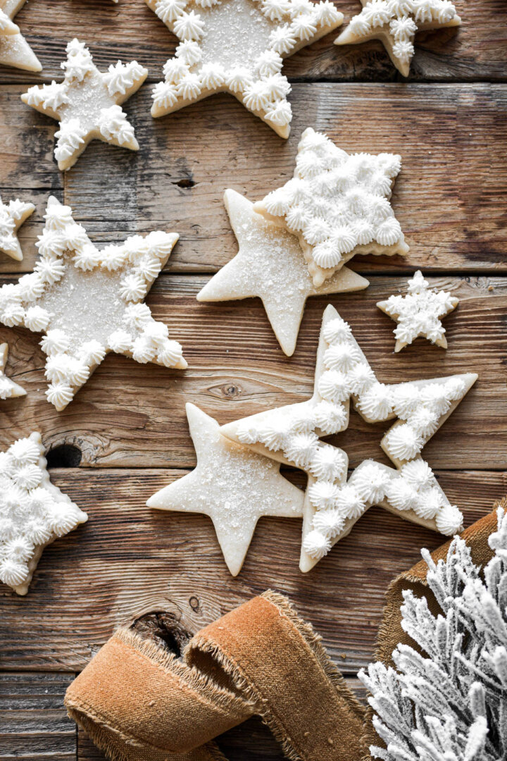 Star cutout cookies with peppermint buttercream piped on top.