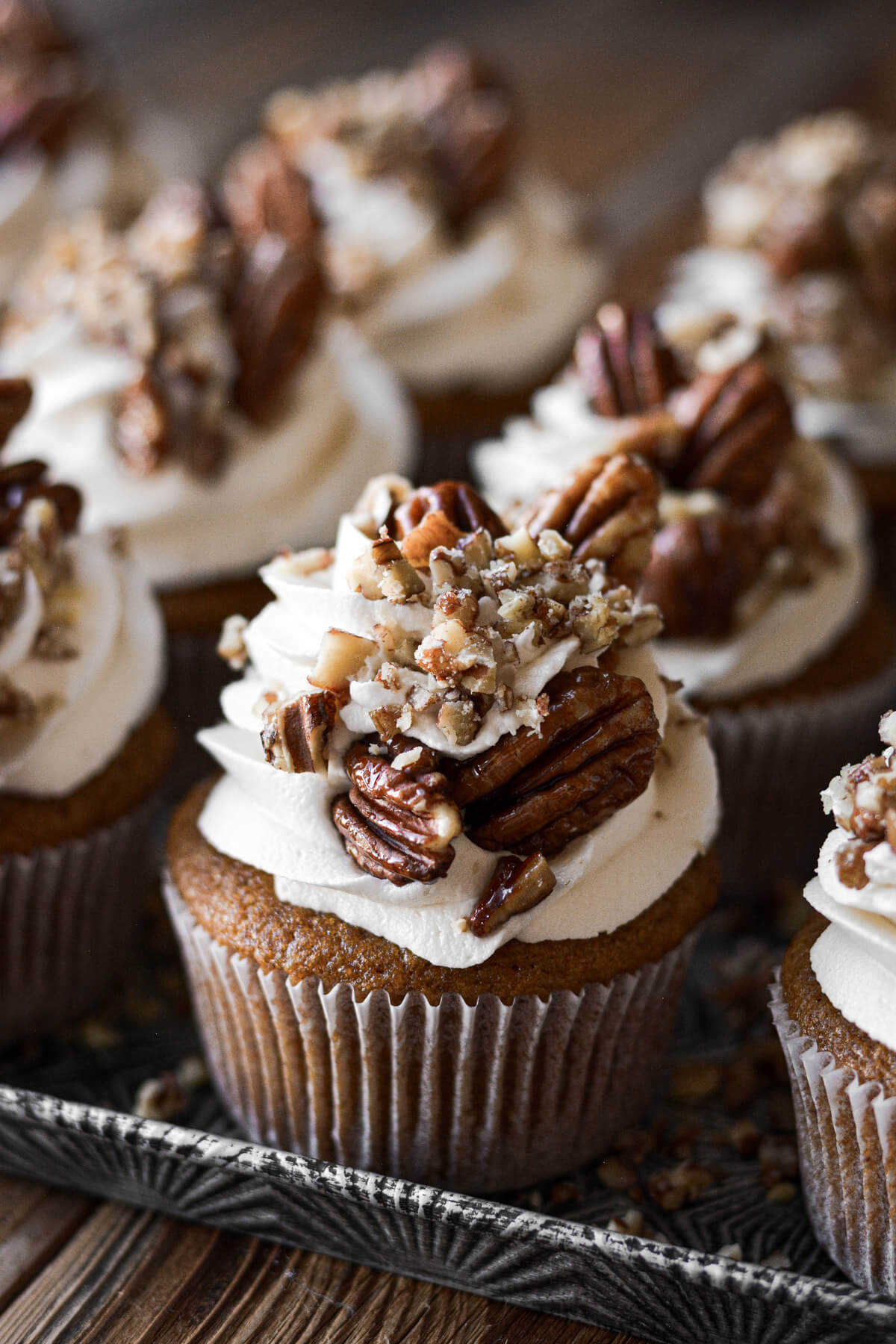Sweet potato cupcakes with marshmallow frosting and maple glazed pecans.