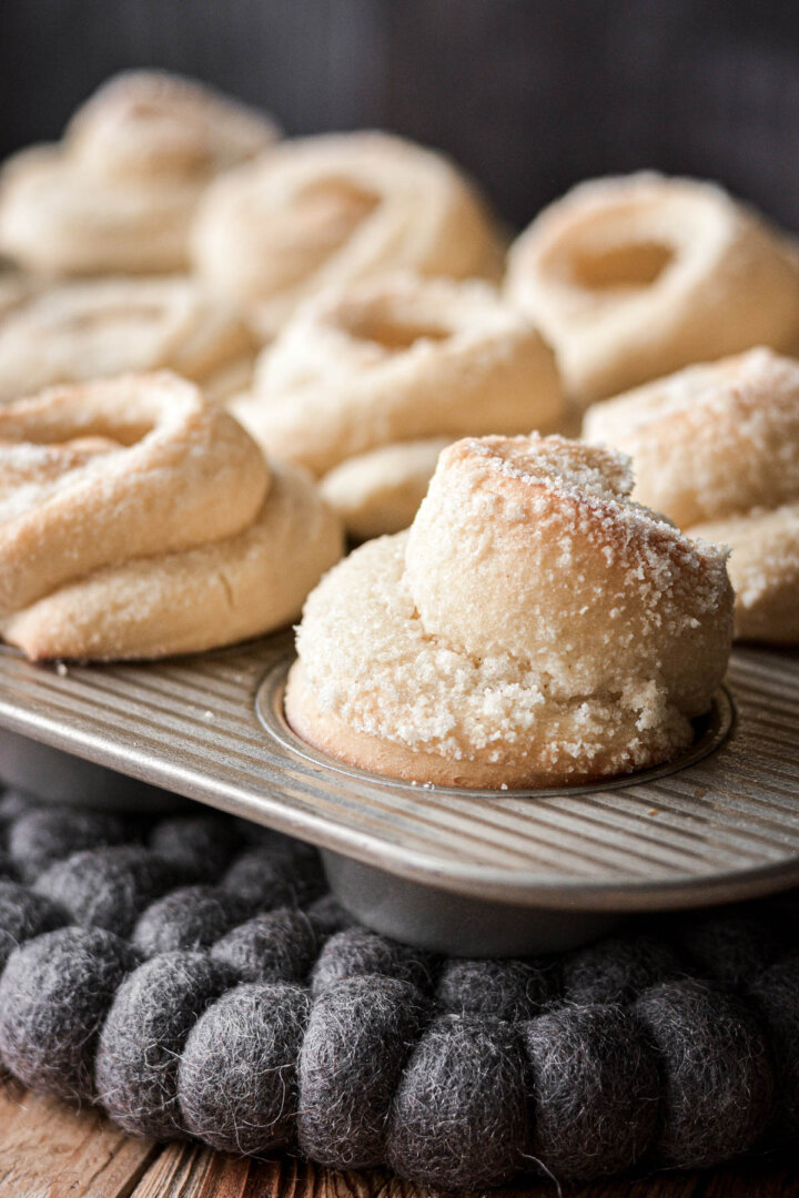 Almond sweet rolls in a muffin pan.