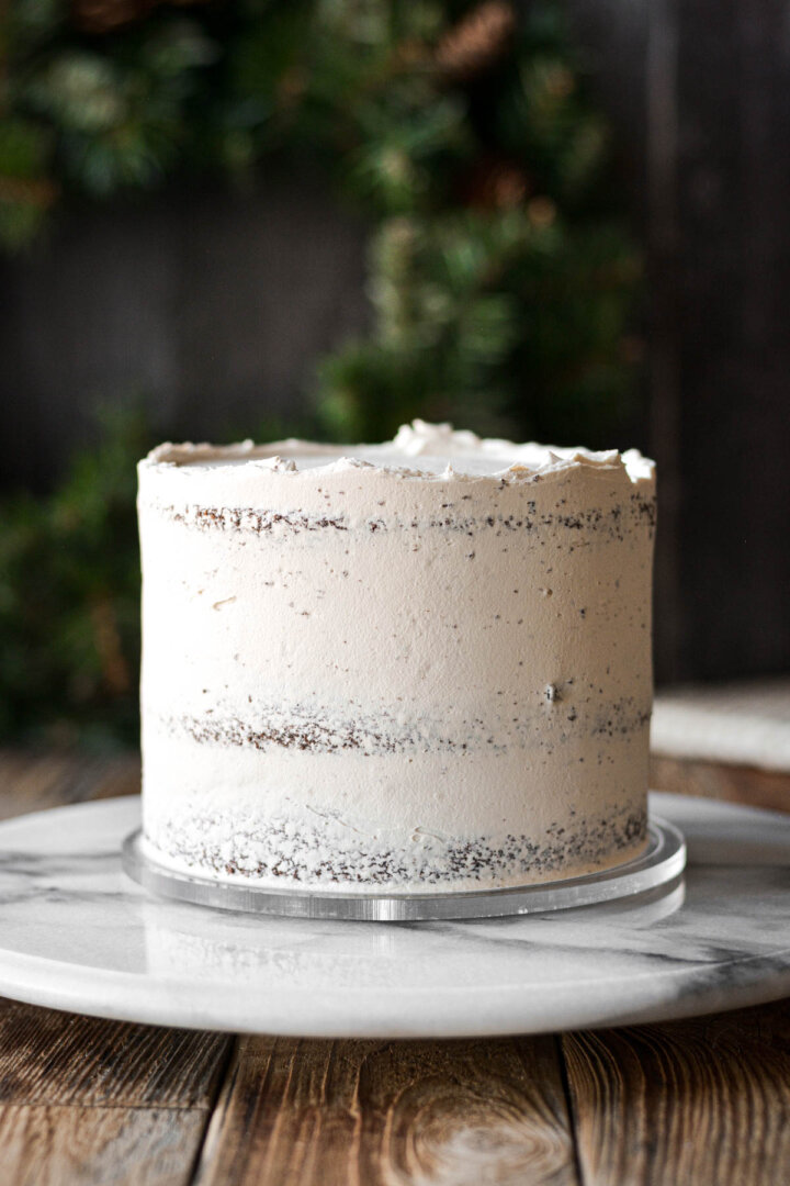 Chocolate cake with a crumb coat of maple buttercream.