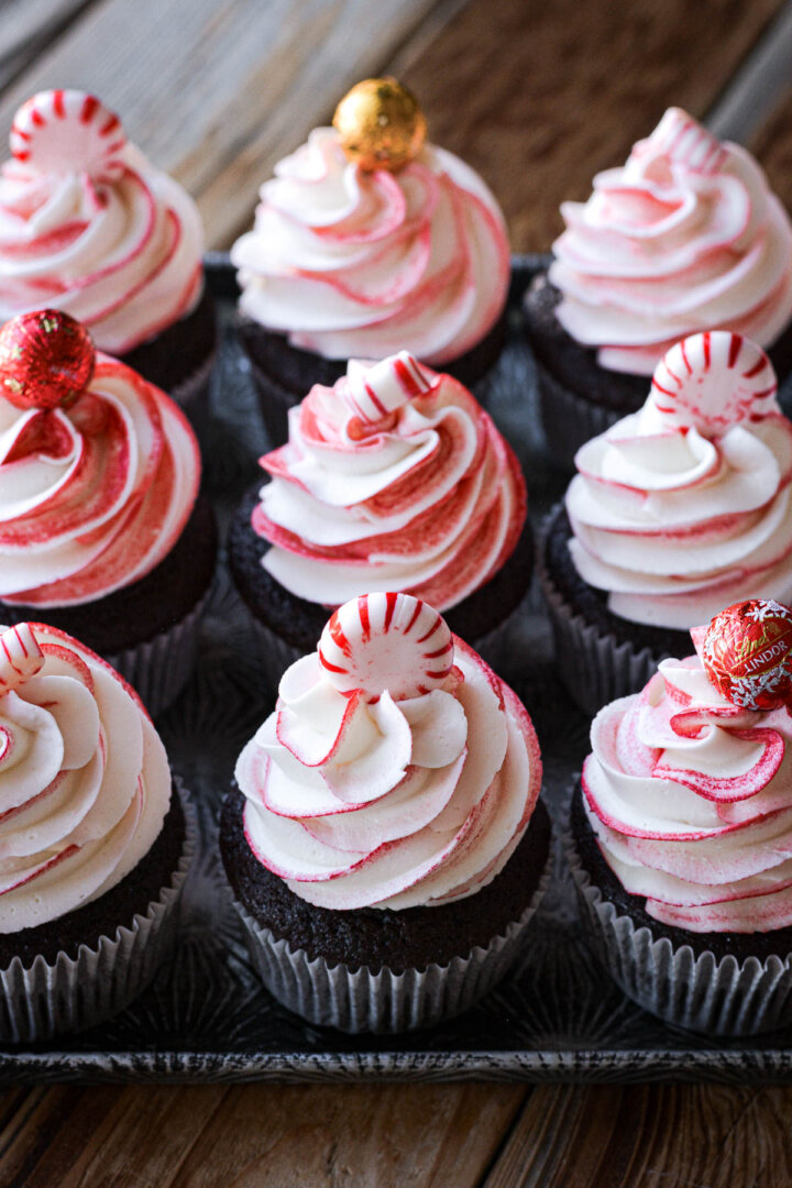 Chocolate peppermint cupcakes topped with candy.