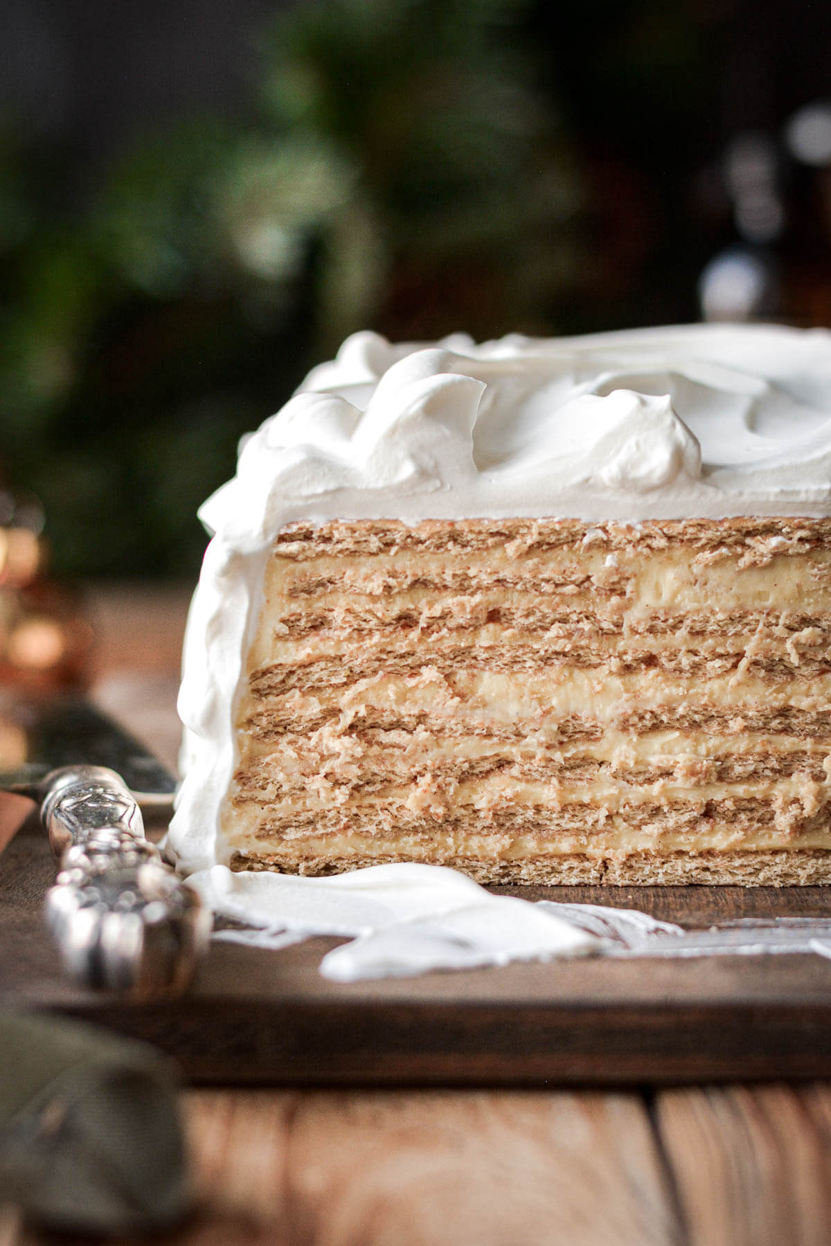 Eggnog icebox cake, with a slice cut to show the layers inside.