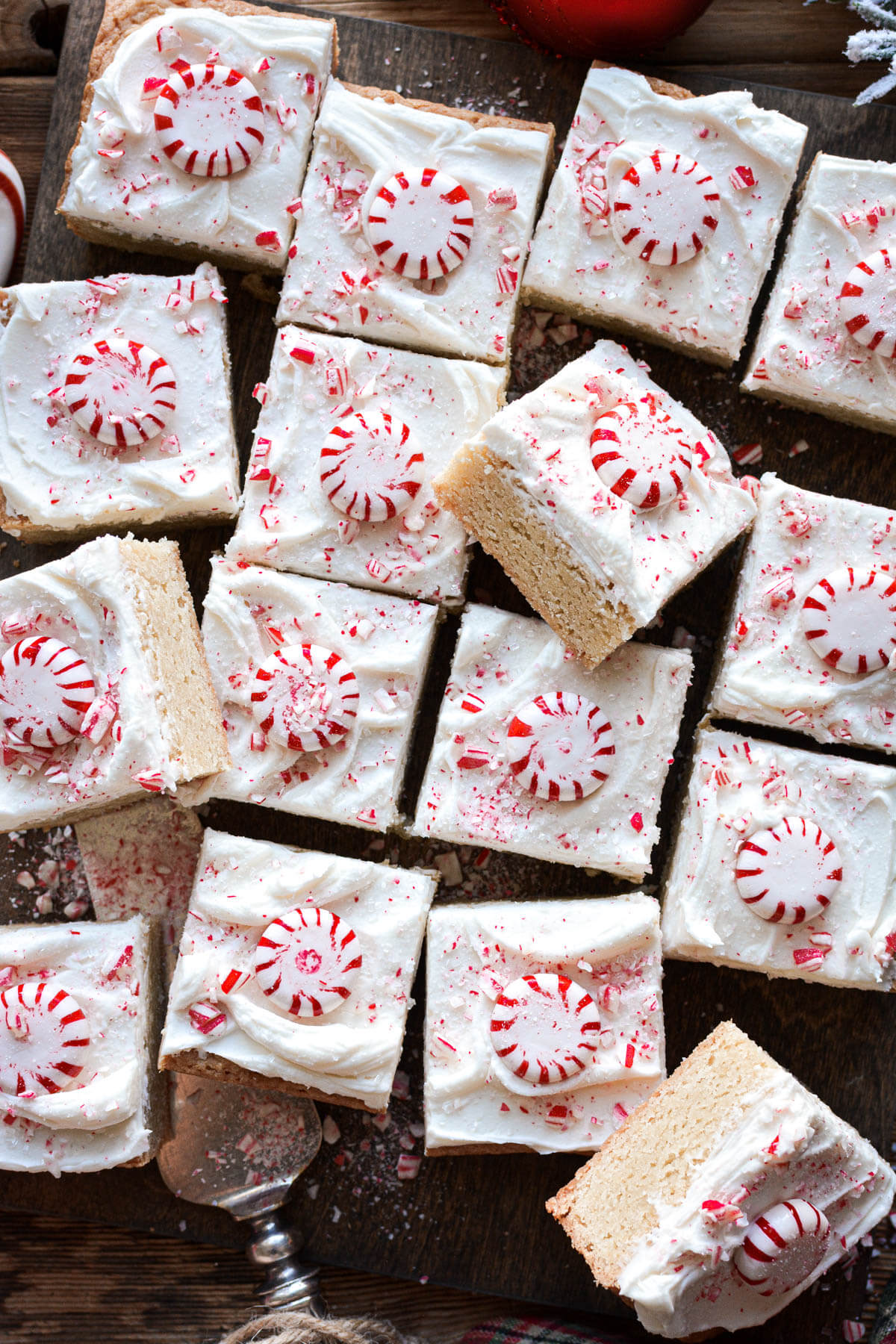 Frosted peppermint blondies topped with peppermint candy.