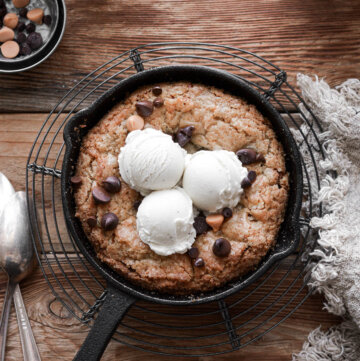 Butterscotch chocolate chip blondie baked in a mini skillet and topped with ice cream.
