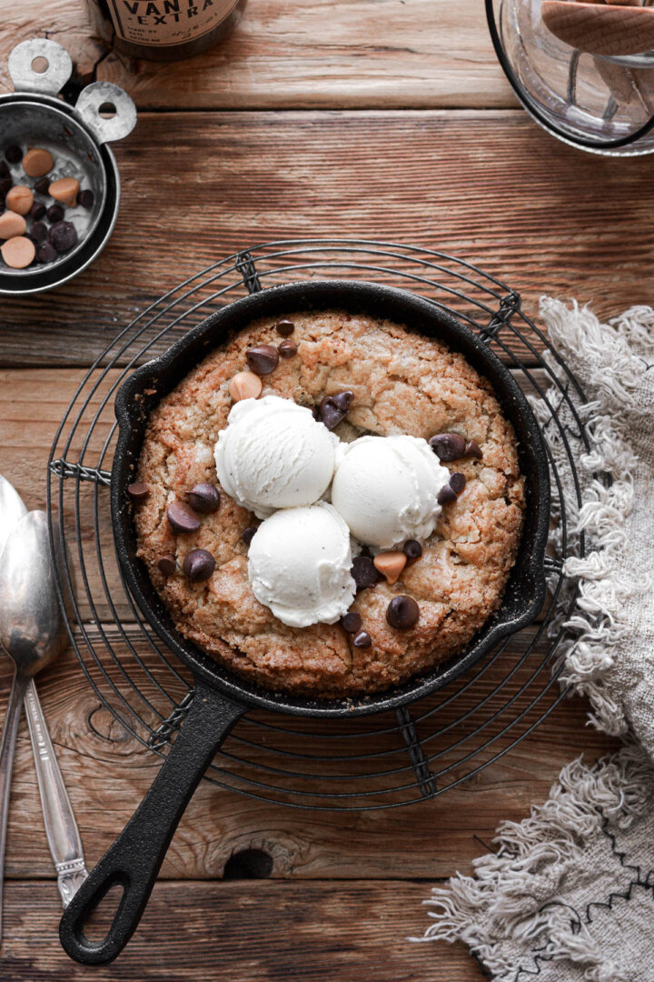 Butterscotch chocolate chip blondie baked in a mini skillet and topped with ice cream.