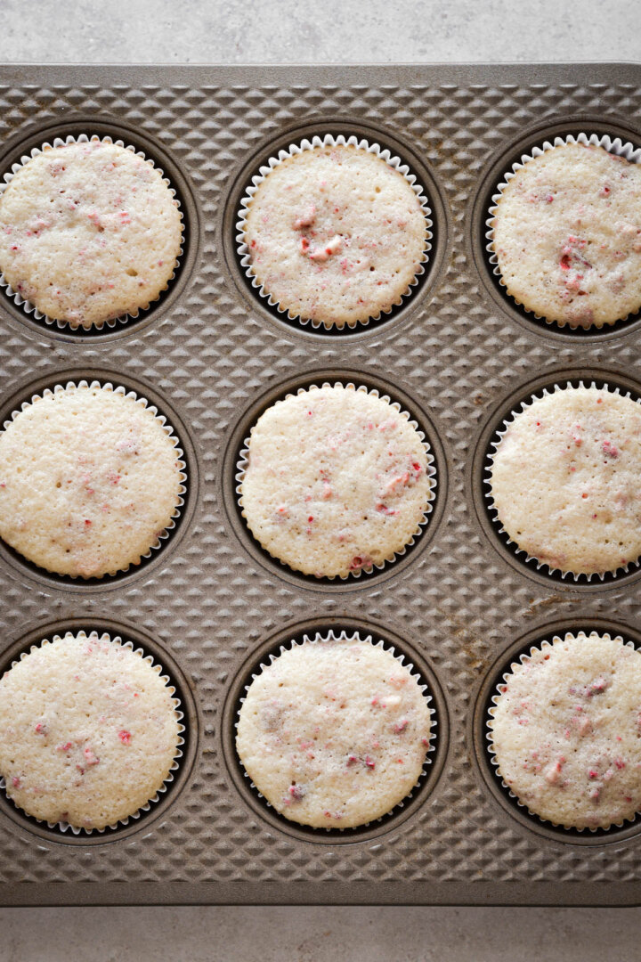 Step 4 for making strawberry cupcakes with freeze dried strawberries.