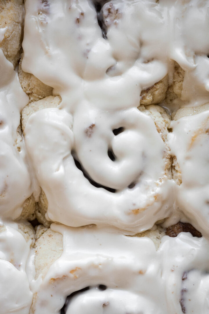 Vanilla icing on biscuit cinnamon rolls.