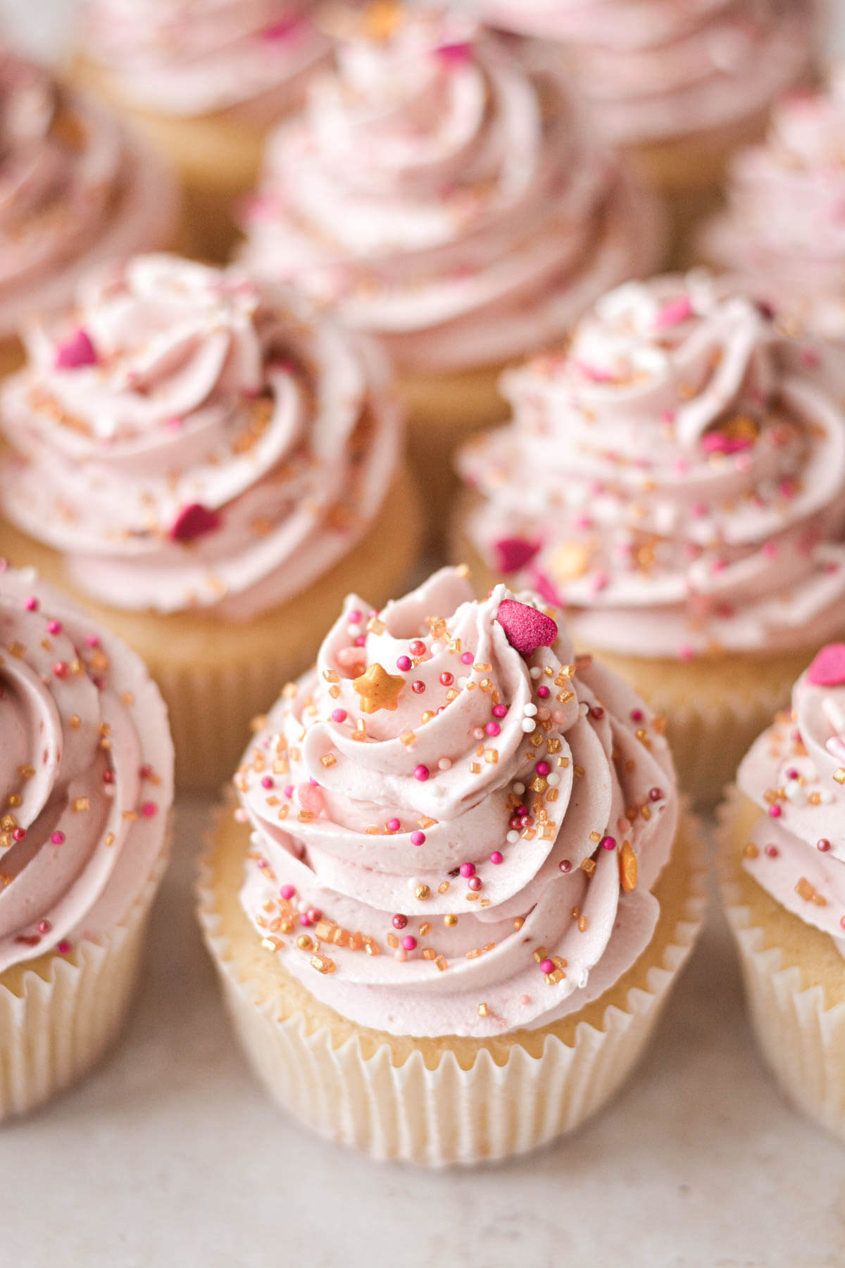 Vanilla raspberry sprinkle cupcakes.
