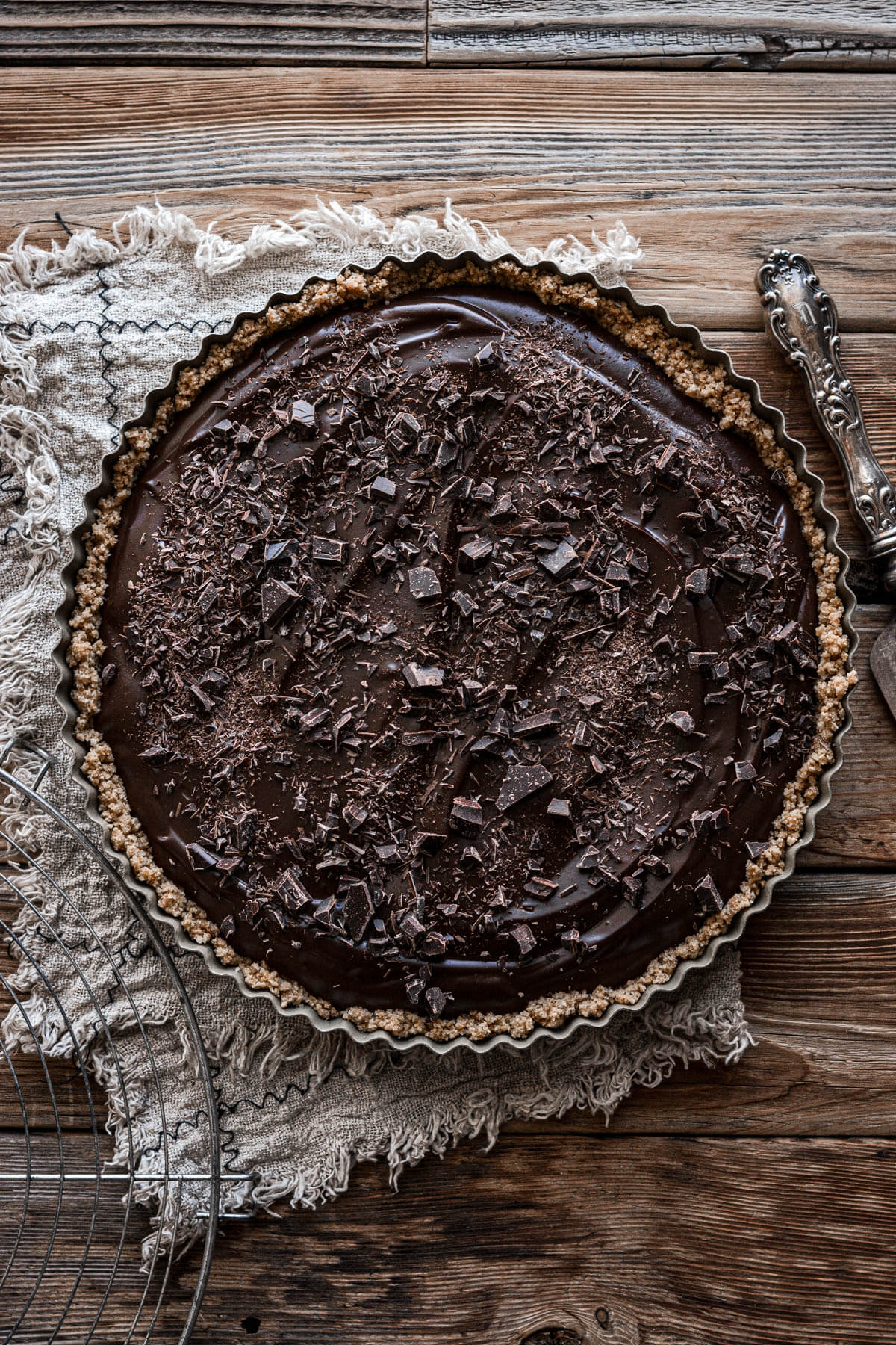 A chocolate cream pie sprinkled with chopped chocolate.