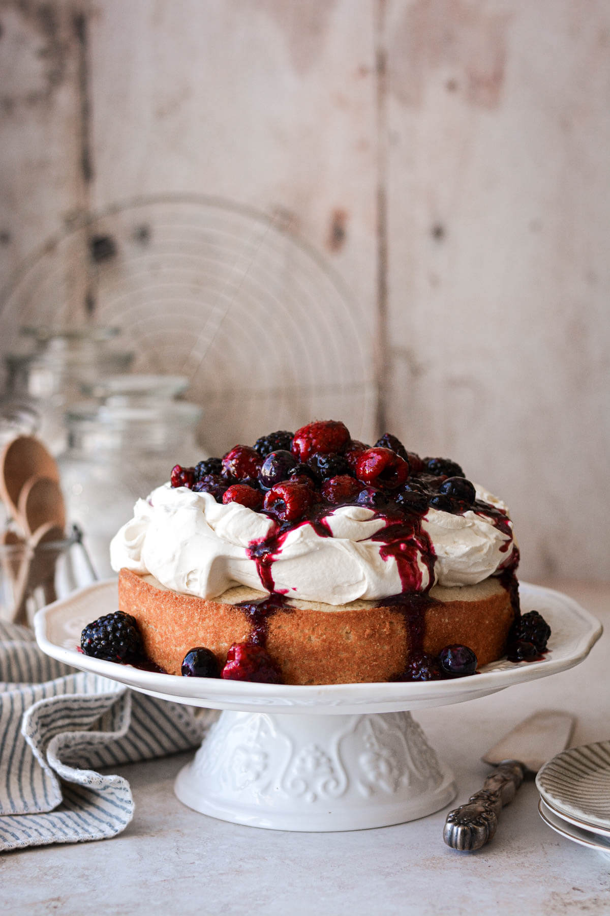 One layer berry shortcake topped with whipped cream and berry compote.