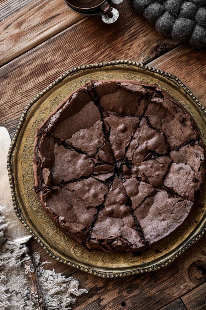 Flourless chocolate cake cut into slices.