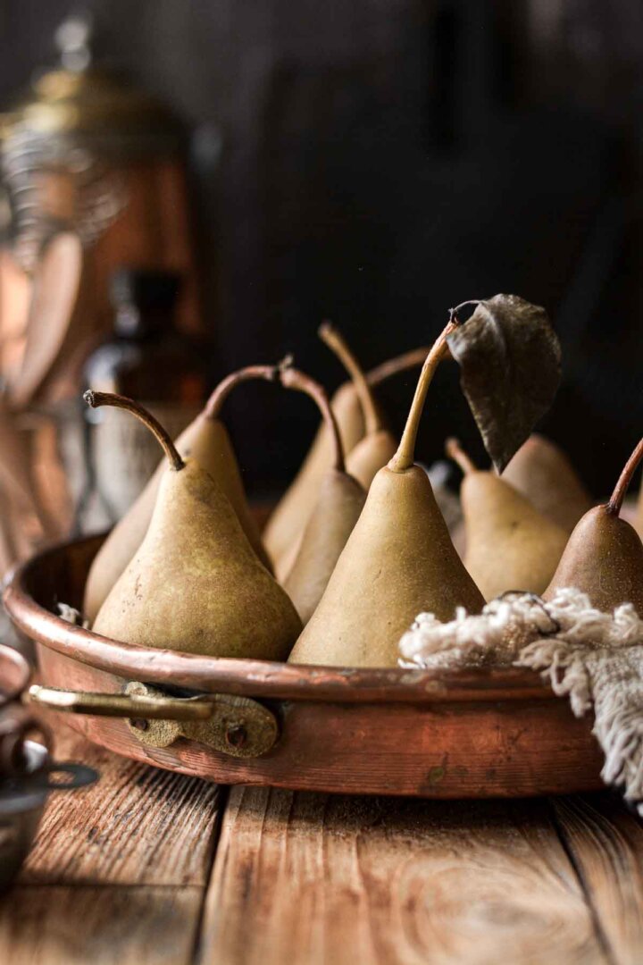 Pears in a copper pan.