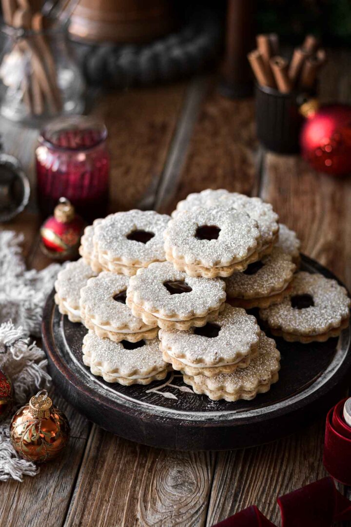 Raspberry almond linzer cookies dusted with powdered sugar.