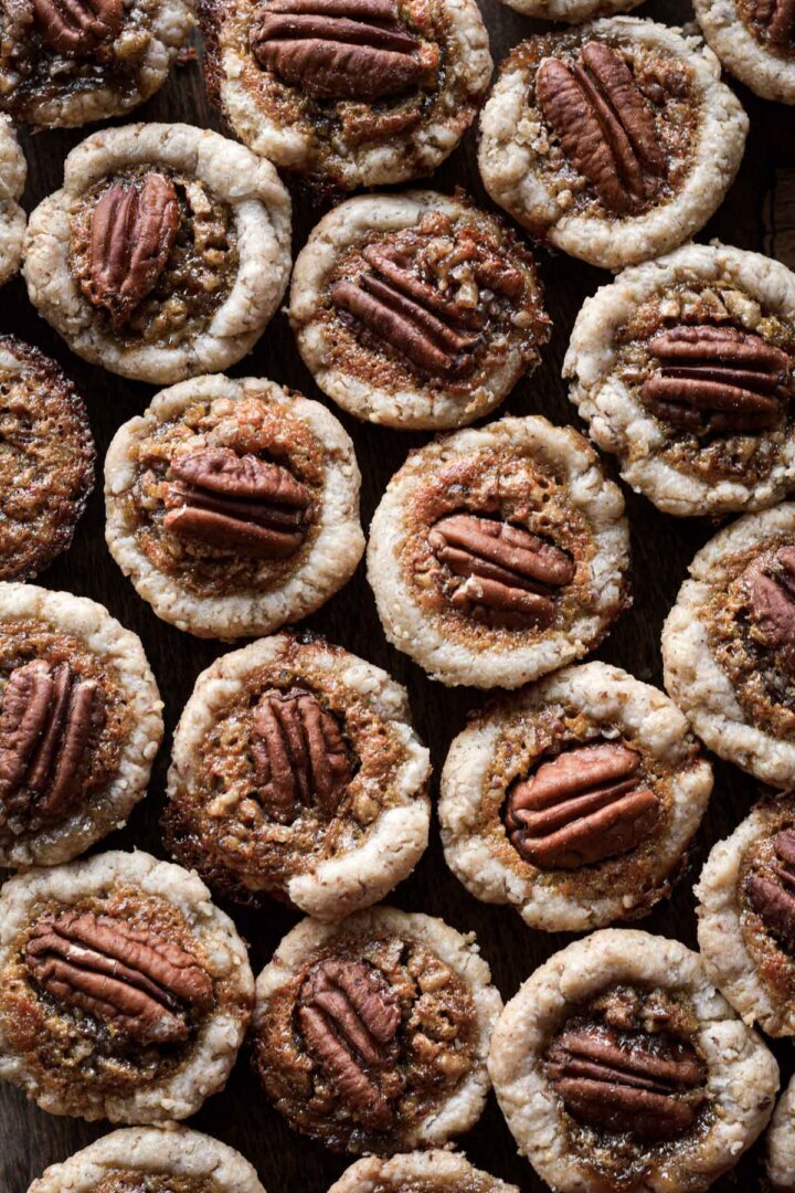 Pecan tassies, topped with pecan halves.