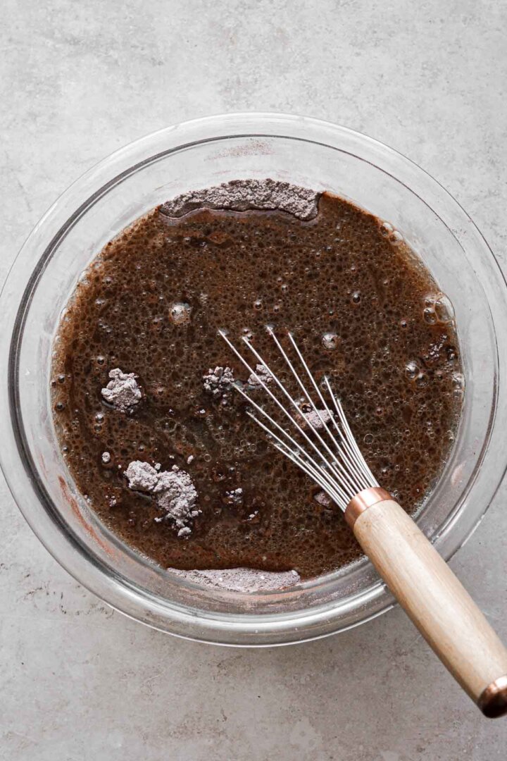 Step 3 for making a chocolate depression cake.