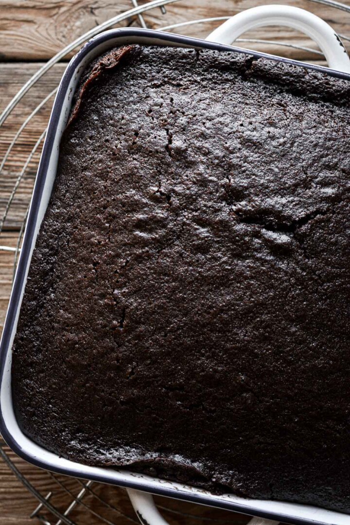 Step 5 for making a chocolate depression cake.