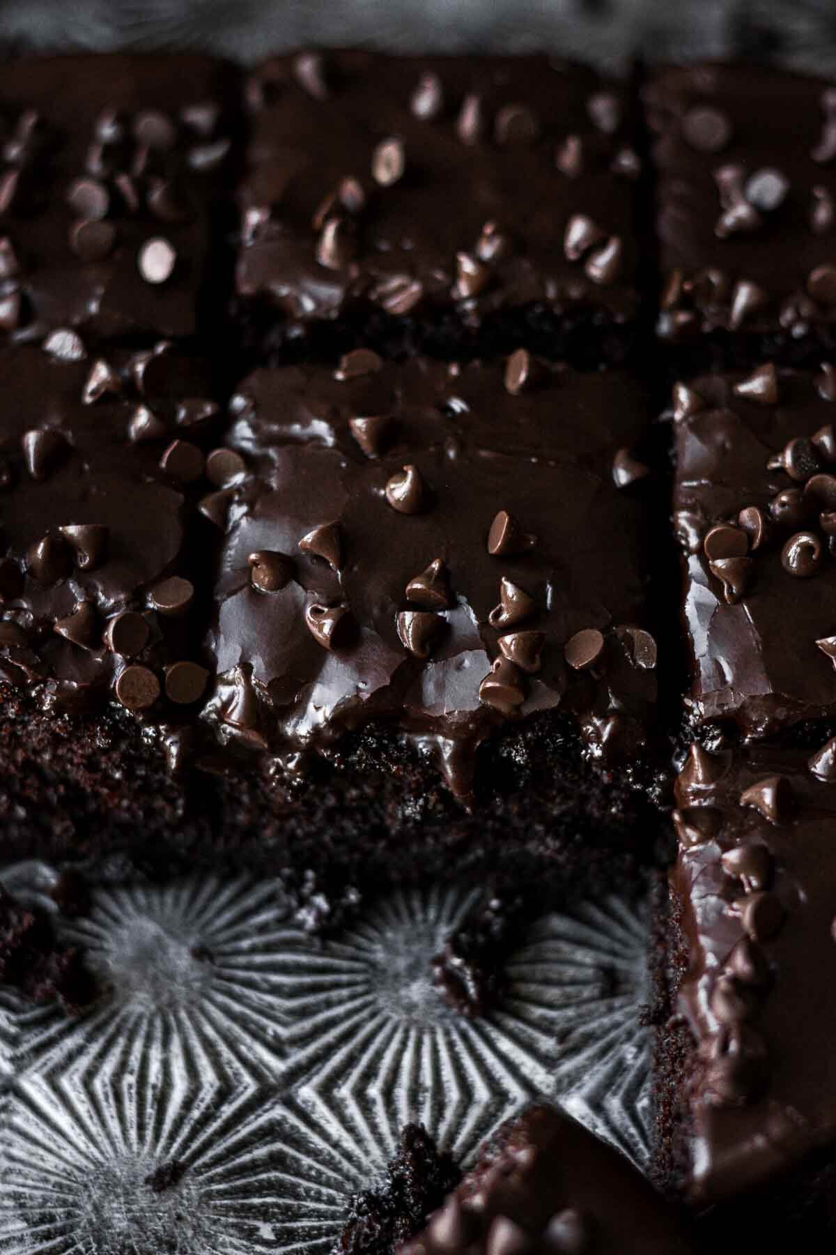 Chocolate depression cake with chocolate icing and chocolate chips.