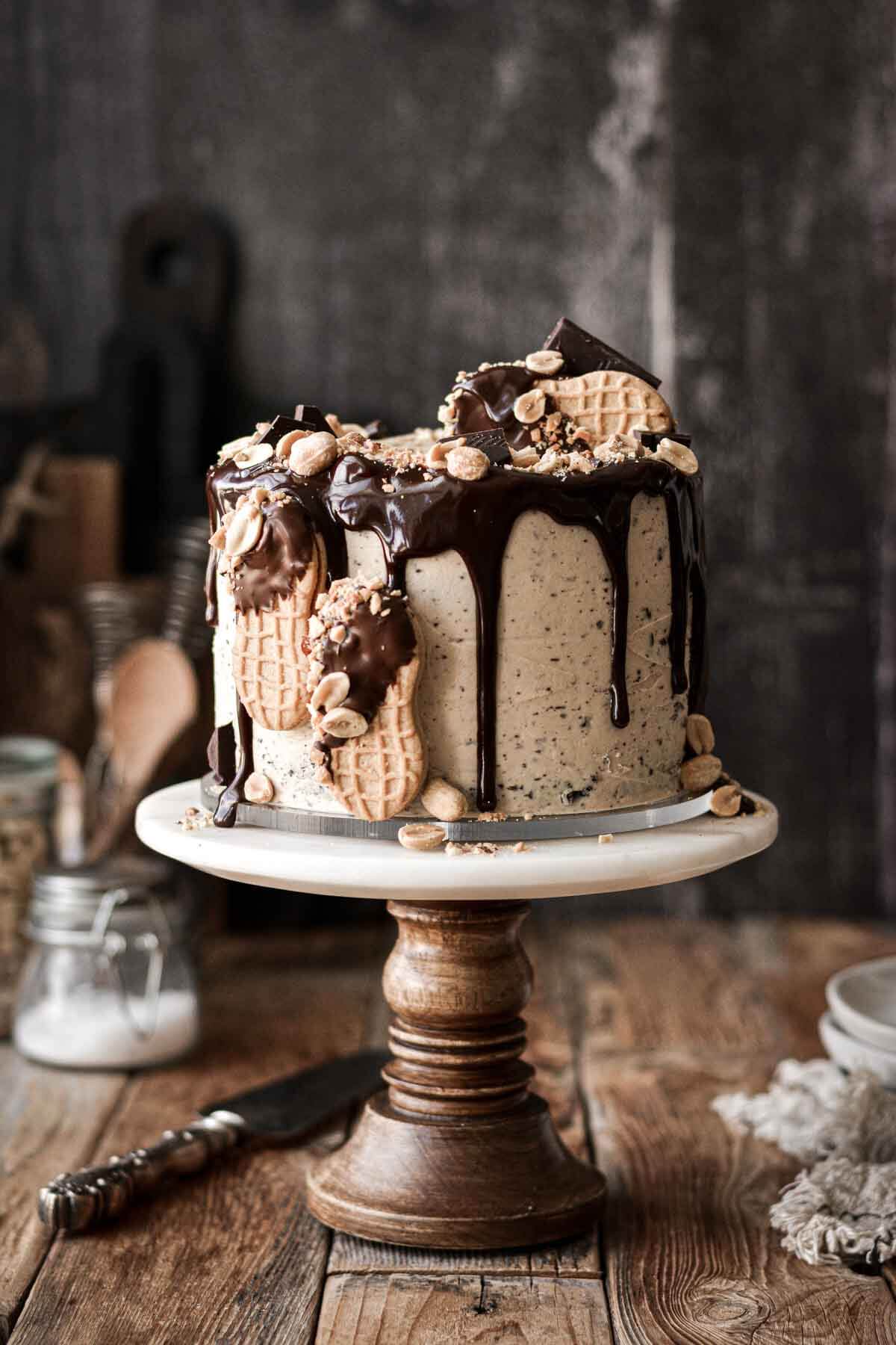 Chocolate peanut butter cake with chocolate ganache drip and nutter butter cookies.