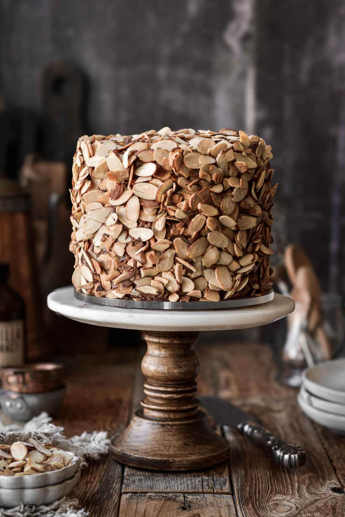 Chocolate almond cake covered with toasted sliced almonds.