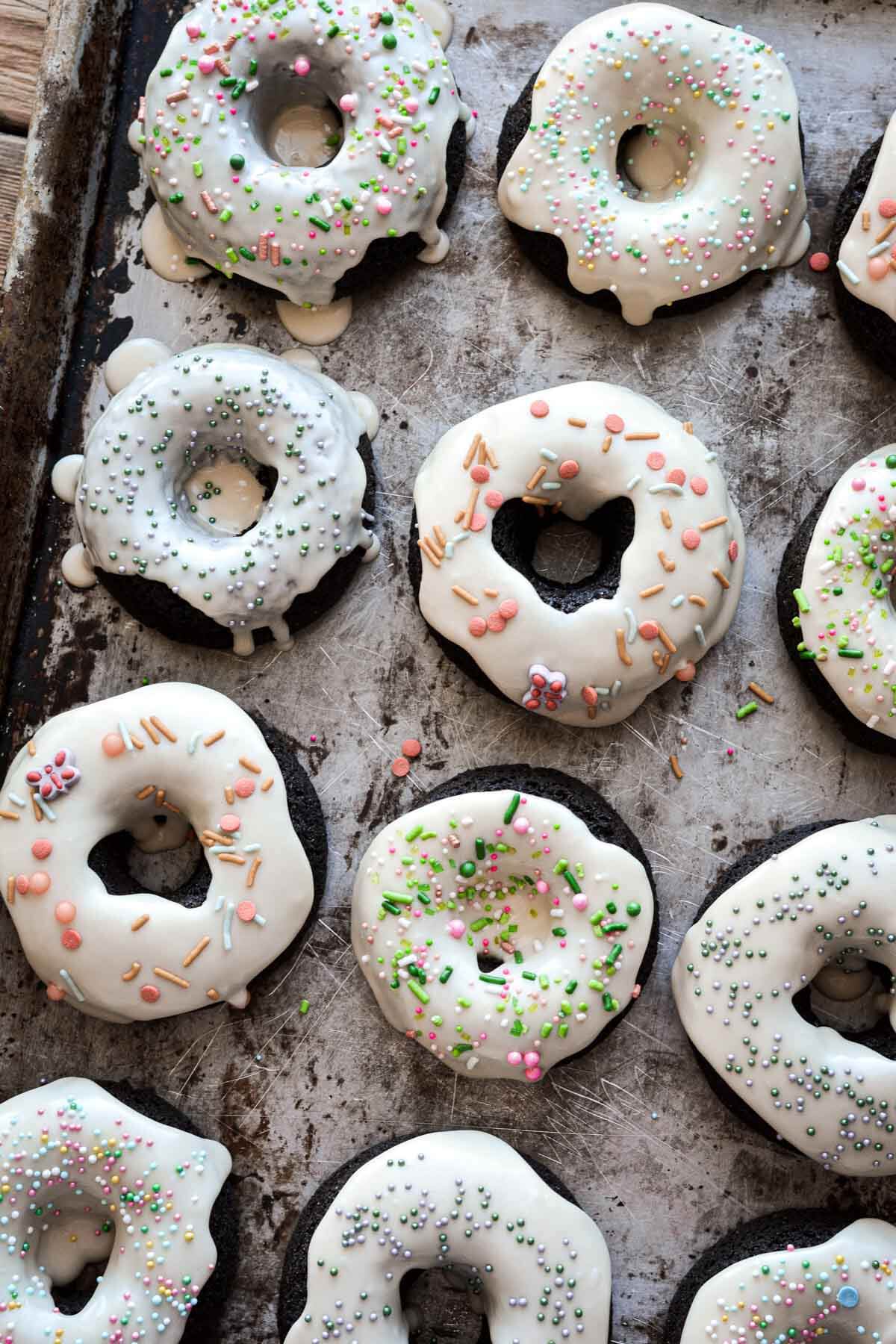 Baked Irish cream cake donuts with sprinkles.