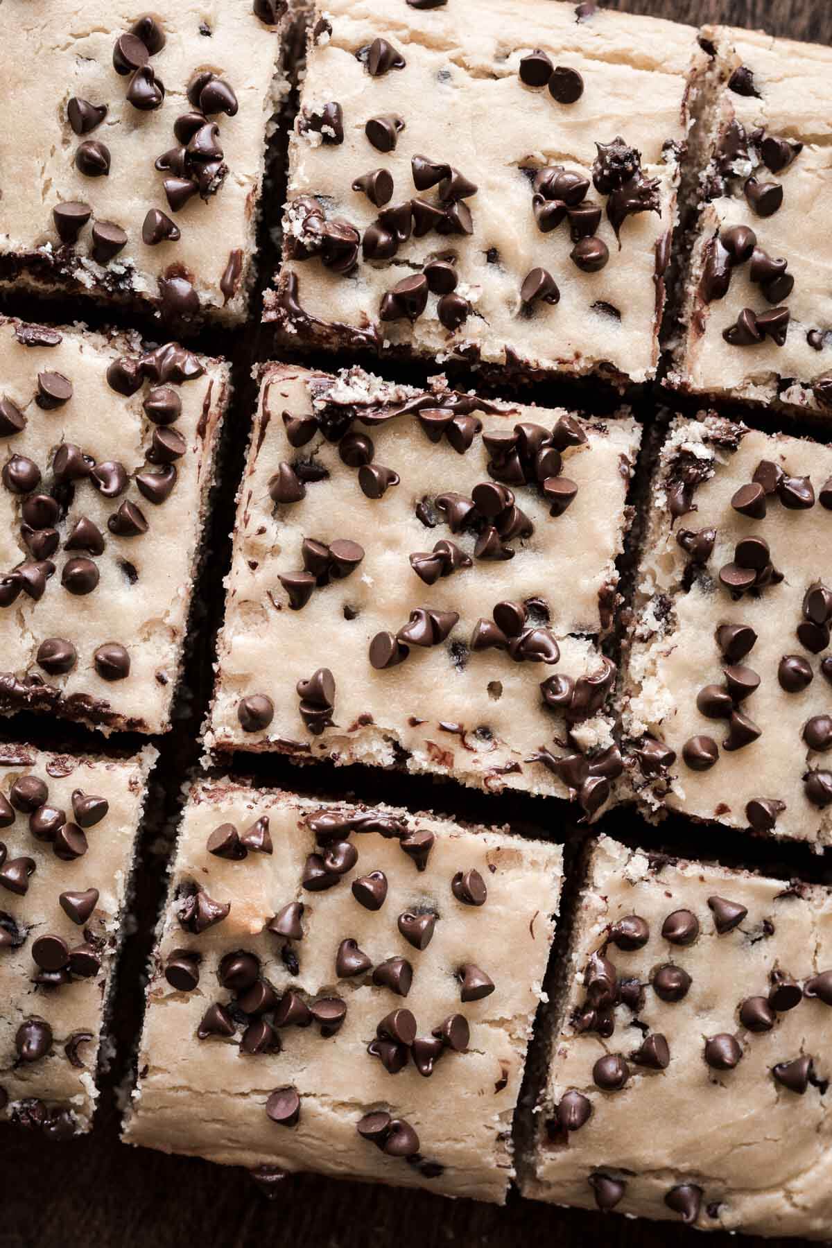 Chocolate chip ricotta cake cut into squares.